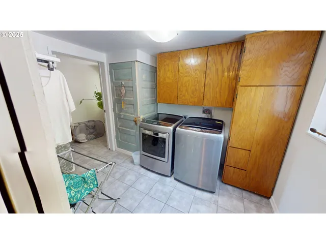 a kitchen with stainless steel appliances a refrigerator a sink a stove top oven