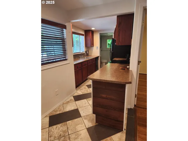 a living room with a couch and a dresser