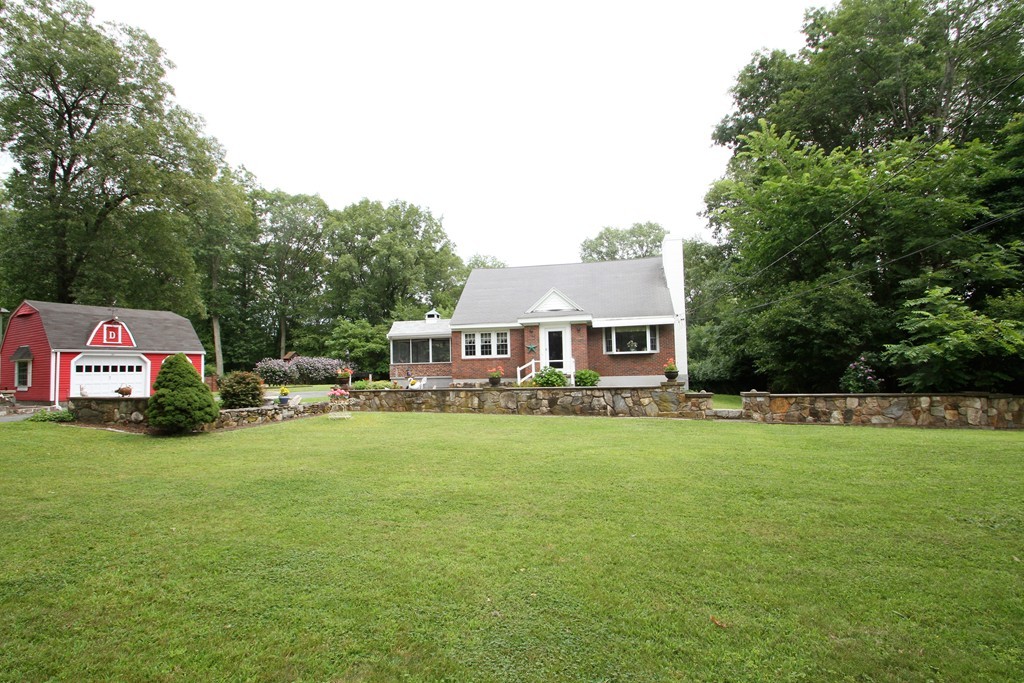 43 Higley Road Ashland, MA 01721 - Photo 1 of 28 a front view of a house with a garden