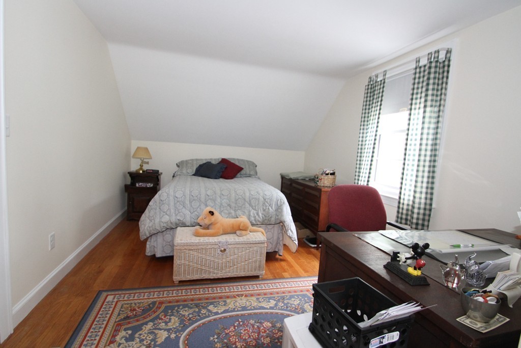 43 Higley Road Ashland, MA 01721 - Photo 23 of 28 a bedroom with two beds and wooden floor