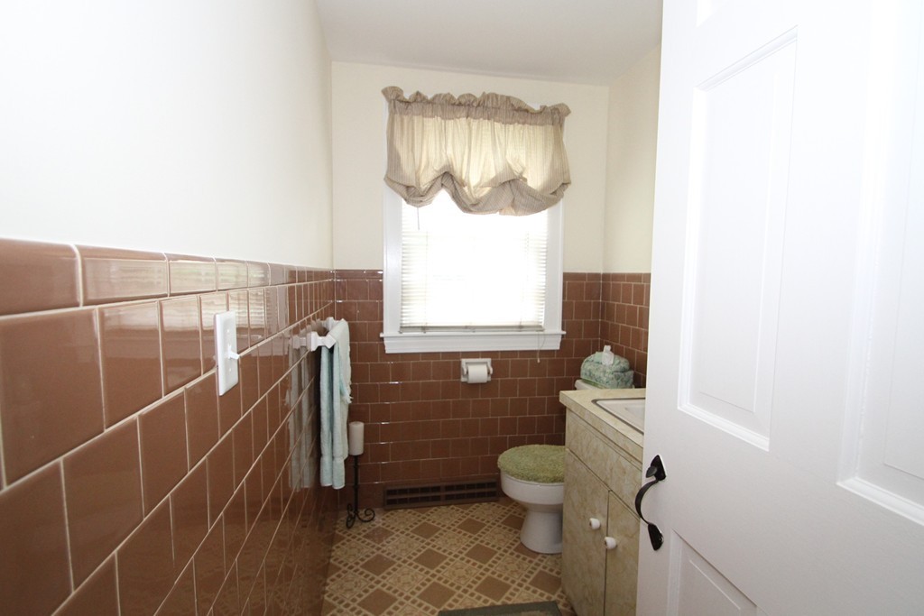 43 Higley Road Ashland, MA 01721 - Photo 28 of 28 a bathroom with a toilet and a shower