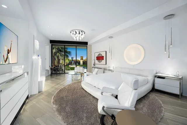 a view of a swimming pool with a patio