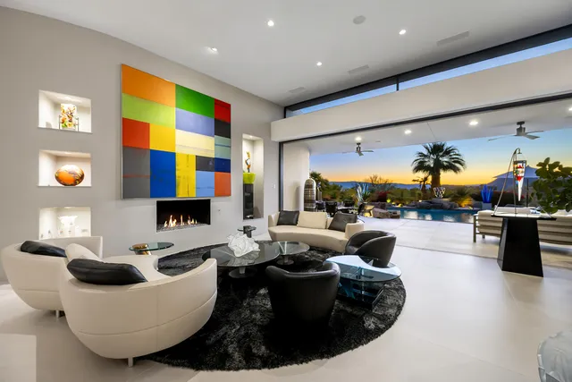 a view of a backyard with a patio and outdoor seating