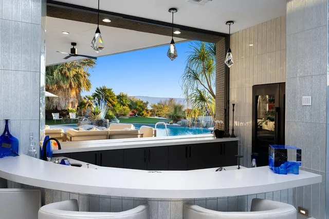 a room with furniture and air hockey table