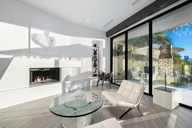 a view of a garden with a building in the background