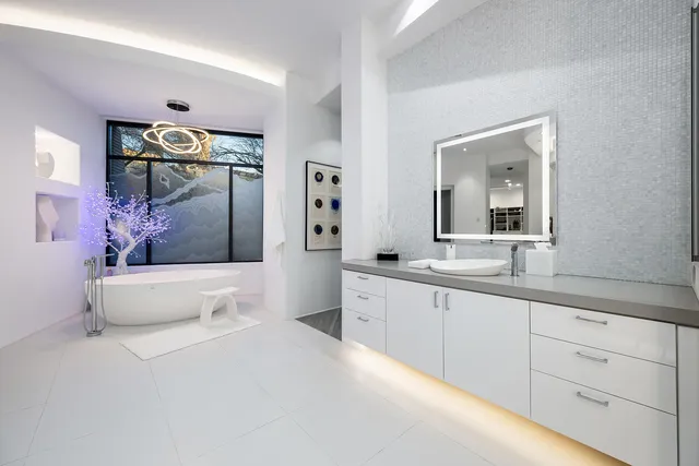 front view of a house with a yard and a palm tree