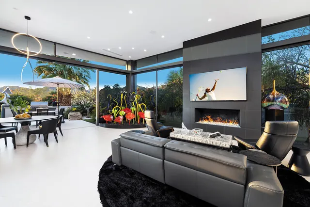 a kitchen that has a sink and a stove in it