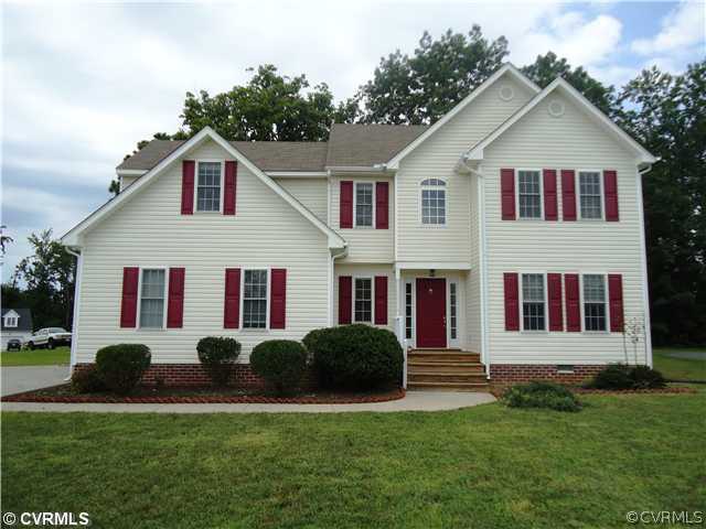3925 Hazelnut Branch Road Midlothian, VA 23112 - Photo 1 of 15 a front view of a house with a yard
