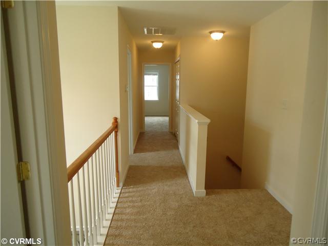 3925 Hazelnut Branch Road Midlothian, VA 23112 - Photo 12 of 15 a view of a hallway with a yellow space
