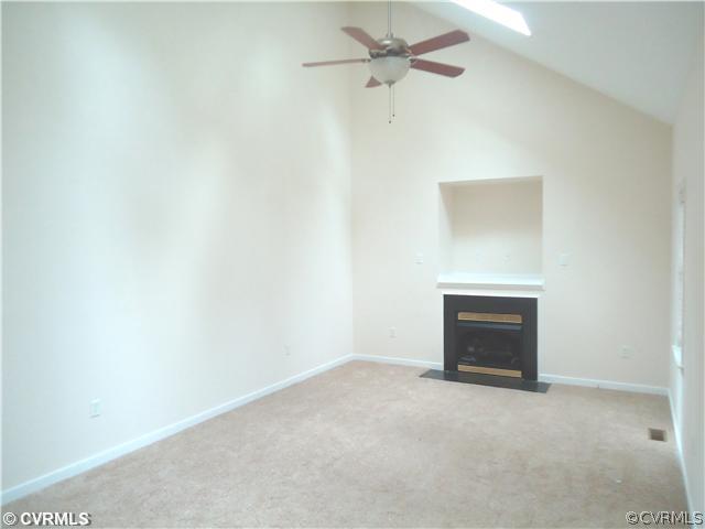 3925 Hazelnut Branch Road Midlothian, VA 23112 - Photo 3 of 15 a view of an empty room with a fireplace