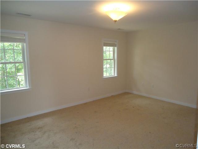 3925 Hazelnut Branch Road Midlothian, VA 23112 - Photo 7 of 15 an empty room with windows