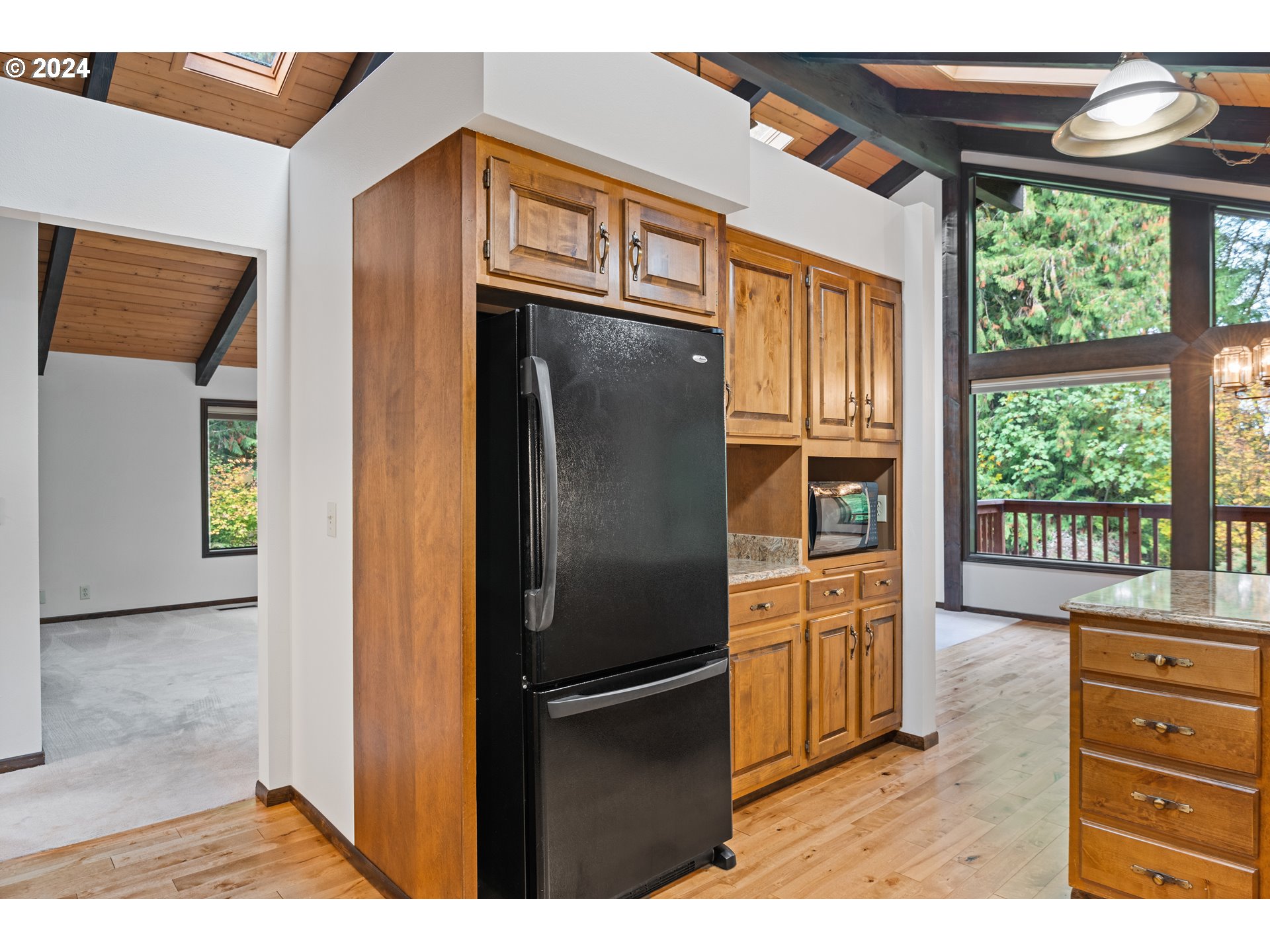 209 Car Road Longview, WA 98632 - Photo 12 of 40 a kitchen with stainless steel appliances granite countertop a refrigerator and a sink