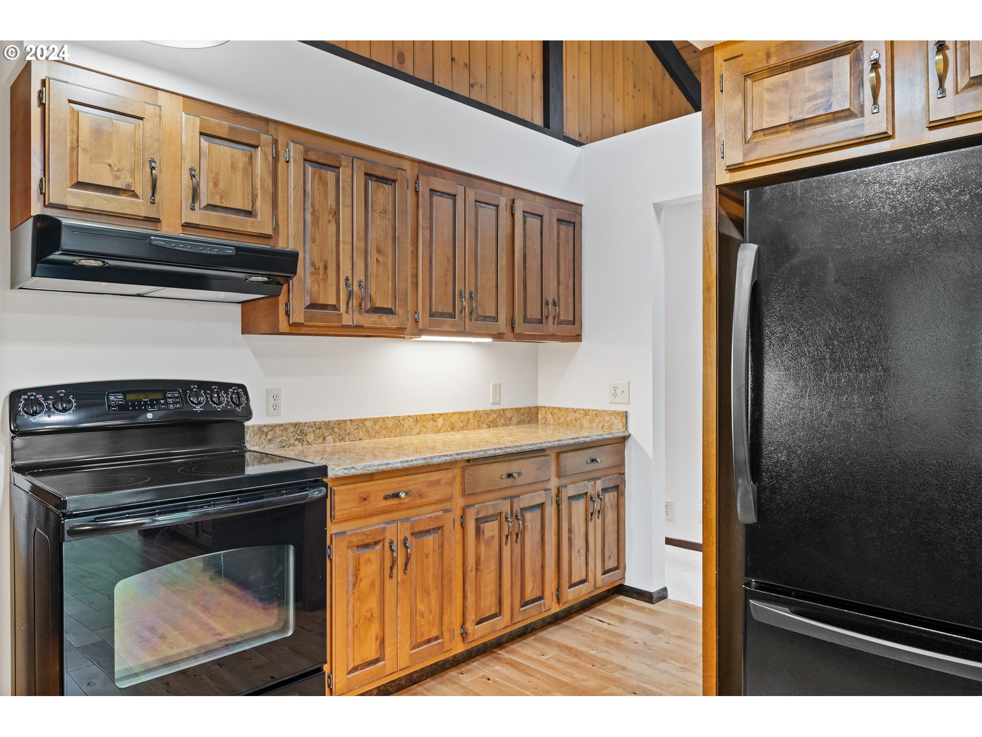 209 Car Road Longview, WA 98632 - Photo 13 of 40 a kitchen with granite countertop cabinets stainless steel appliances and a counter space