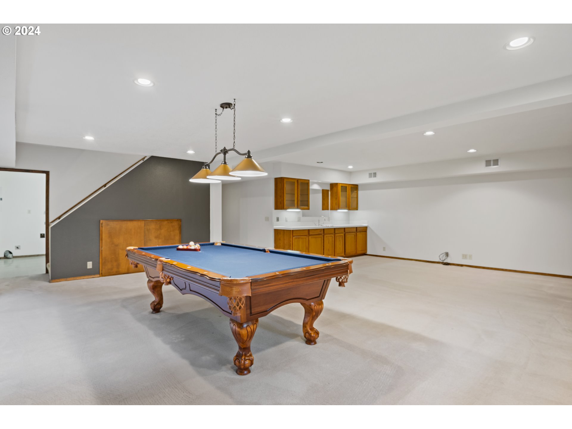 209 Car Road Longview, WA 98632 - Photo 22 of 40 a room with furniture and air hockey table