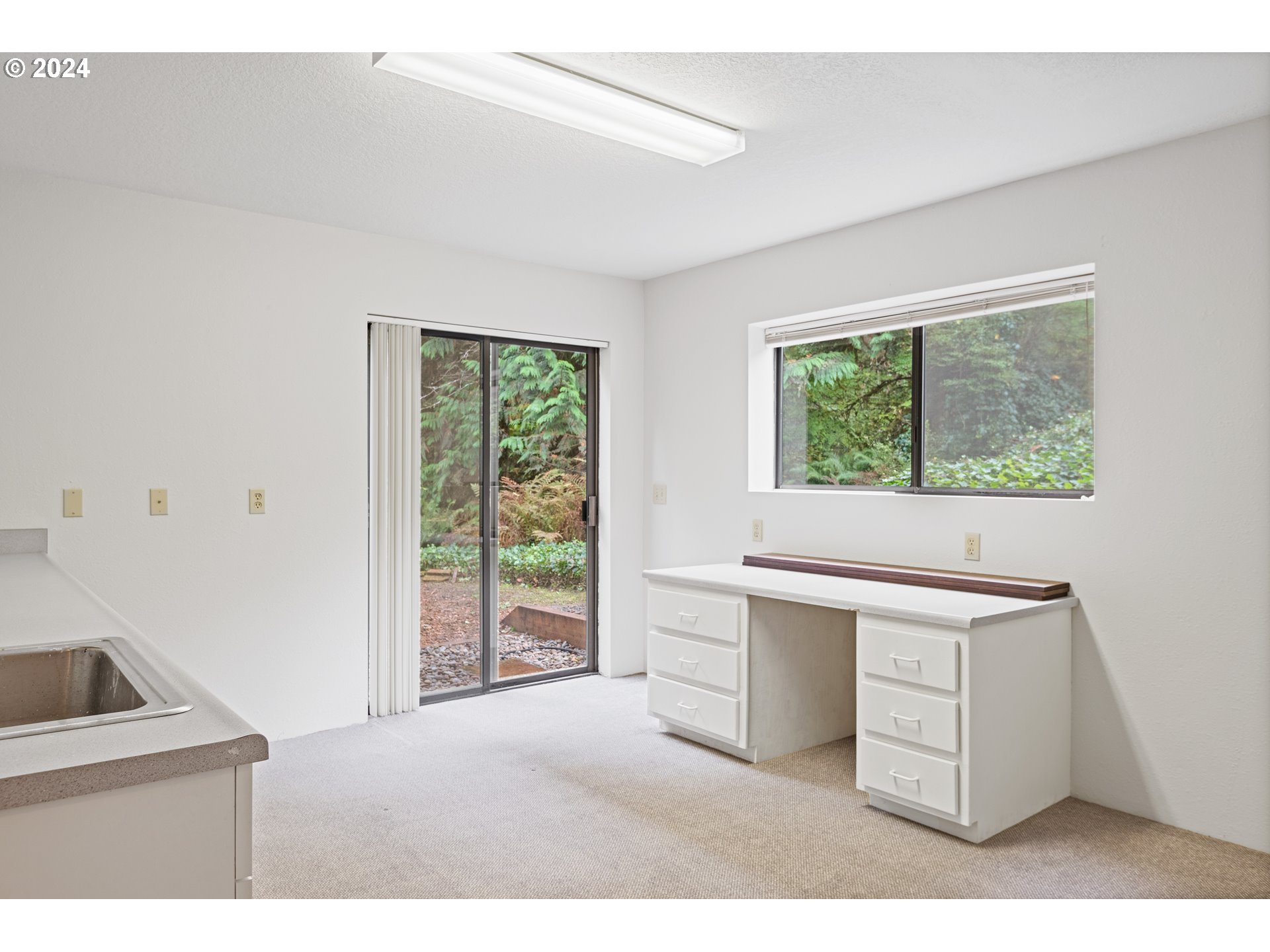 209 Car Road Longview, WA 98632 - Photo 26 of 40 a kitchen with a stove a sink and a window