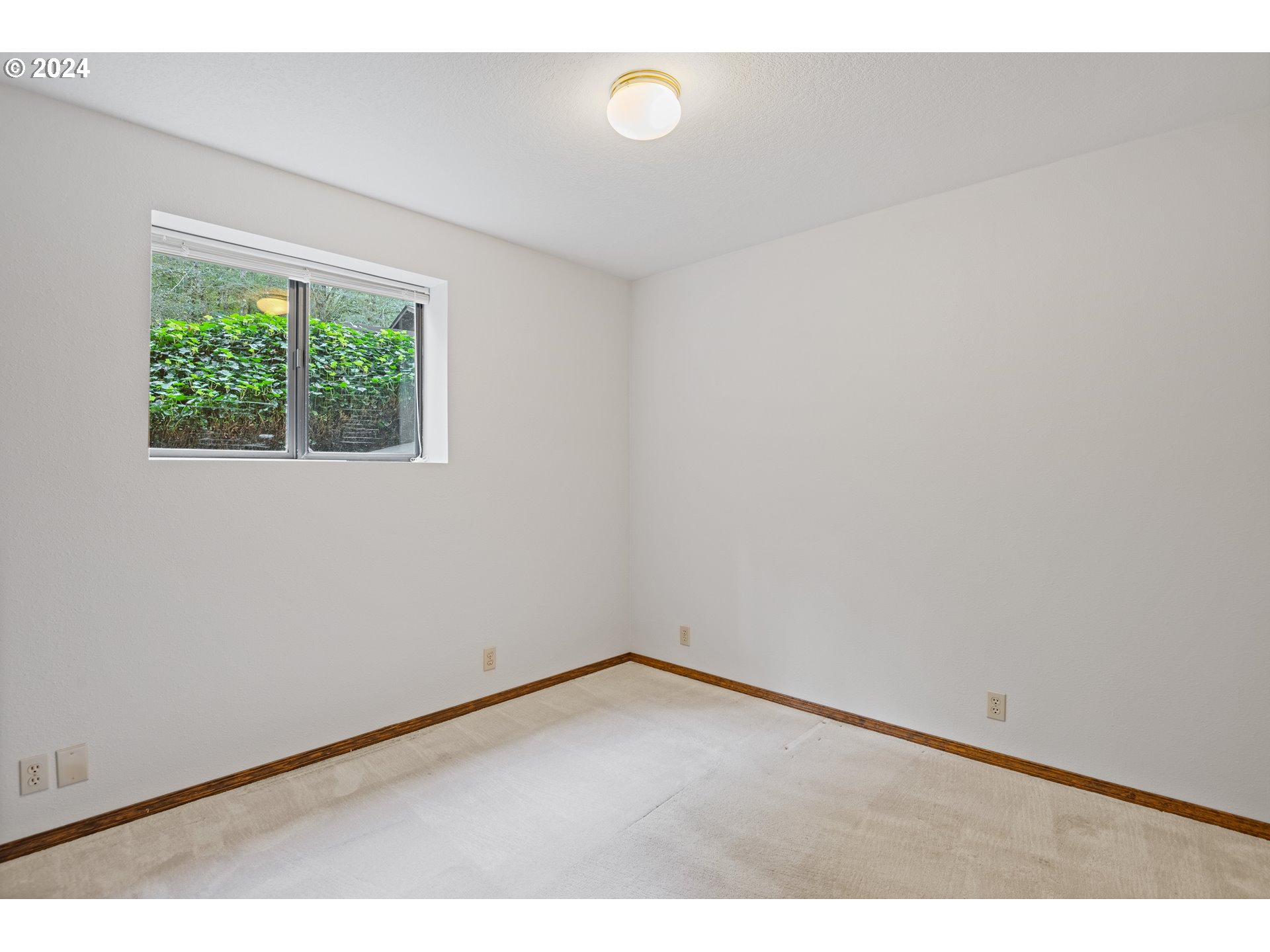 209 Car Road Longview, WA 98632 - Photo 28 of 40 a view of an empty room with a window