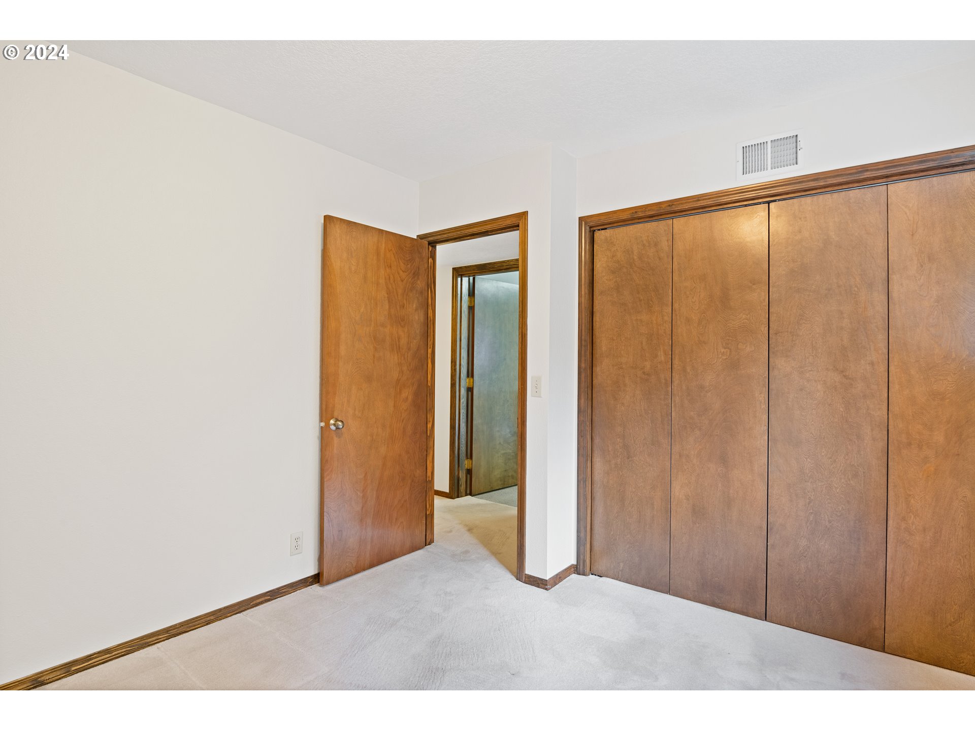 209 Car Road Longview, WA 98632 - Photo 29 of 40 a view of an empty room with wooden floor