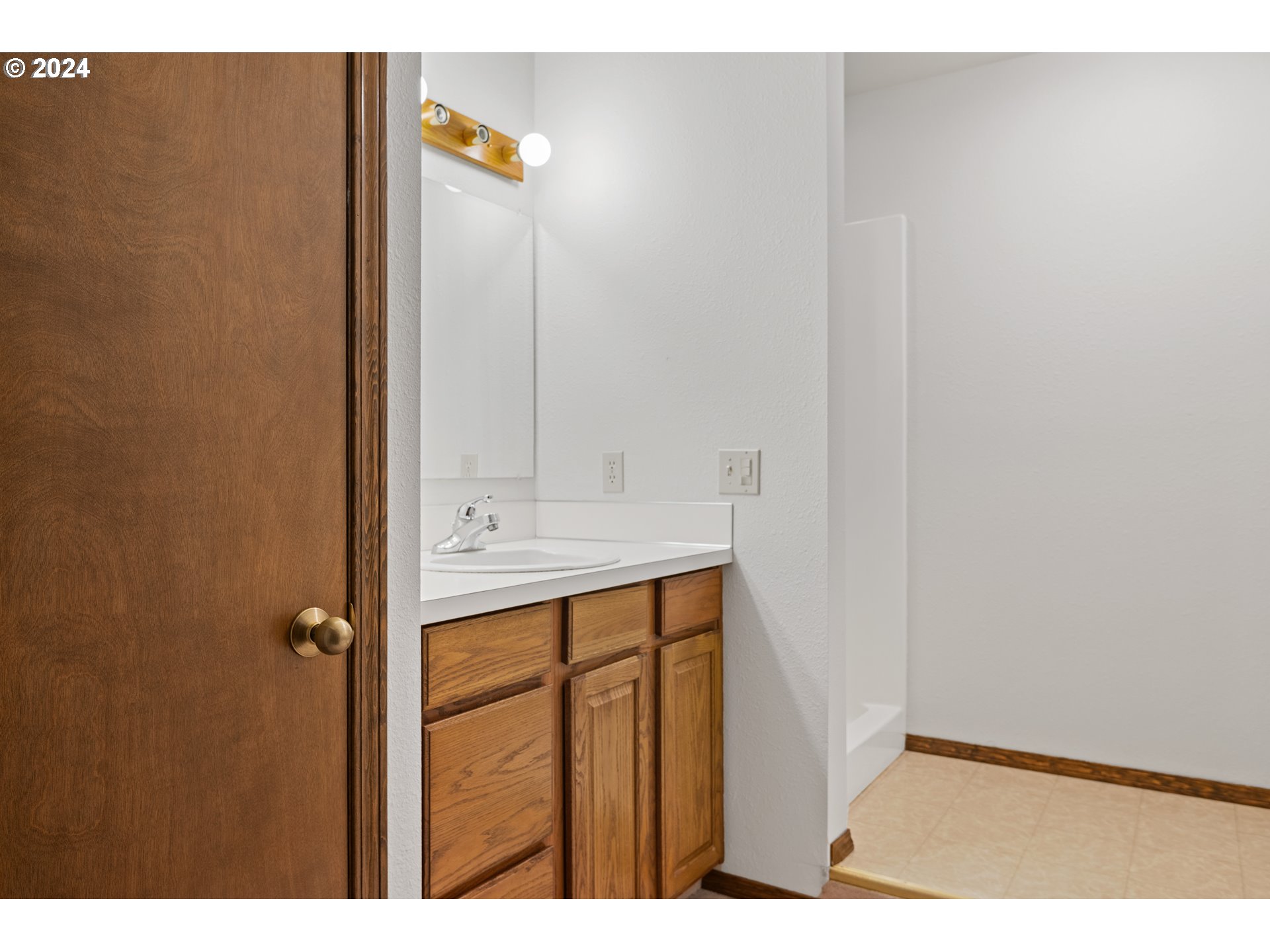 209 Car Road Longview, WA 98632 - Photo 32 of 40 a bathroom with a sink and a mirror