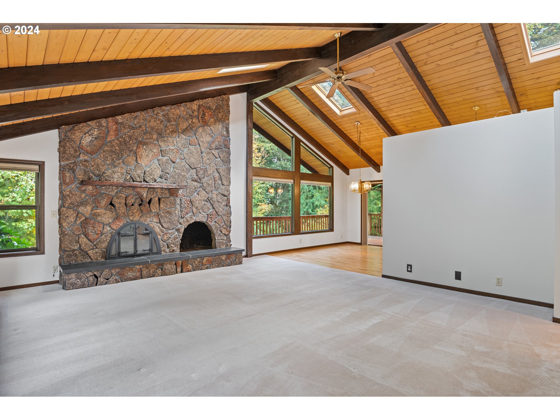 209 Car Road Longview, WA 98632 - Photo 6 of 40 a view of an empty room with a fireplace and a window