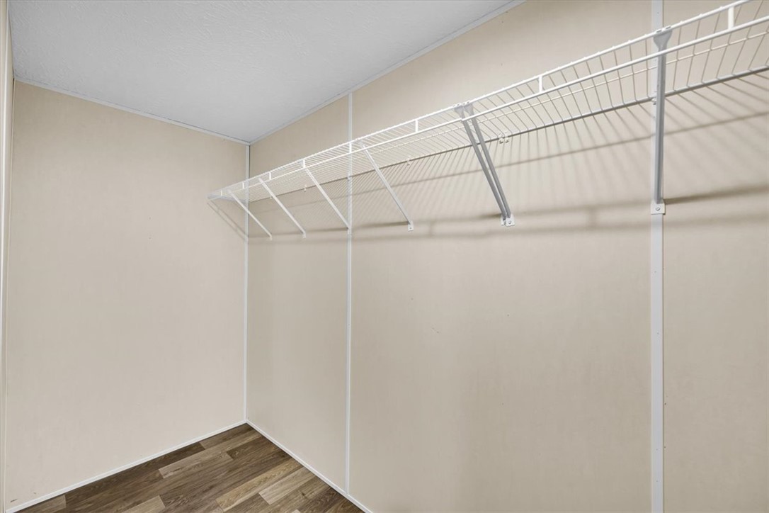 2949 High Shoals Road Anderson, SC 29624 - Photo 13 of 21 This spacious walk-in closet features convenient wire shelving and durable flooring.