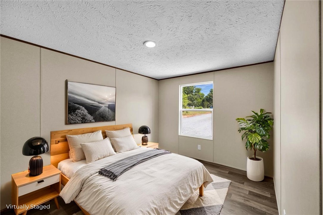 2949 High Shoals Road Anderson, SC 29624 - Photo 16 of 21 This serene bedroom offers a tranquil retreat with ample natural light.