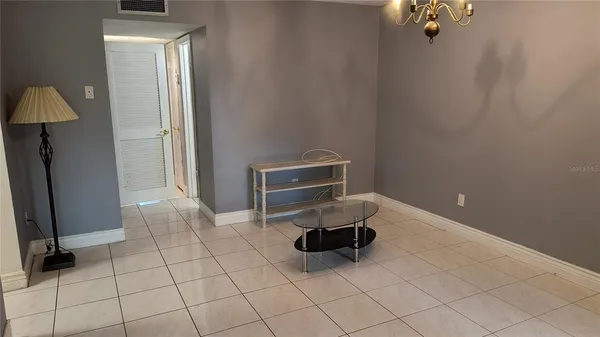 a living room with a couch and a dresser