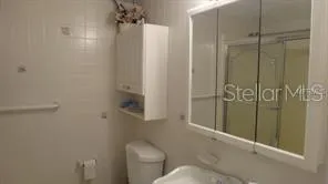 a living room with chairs and a table