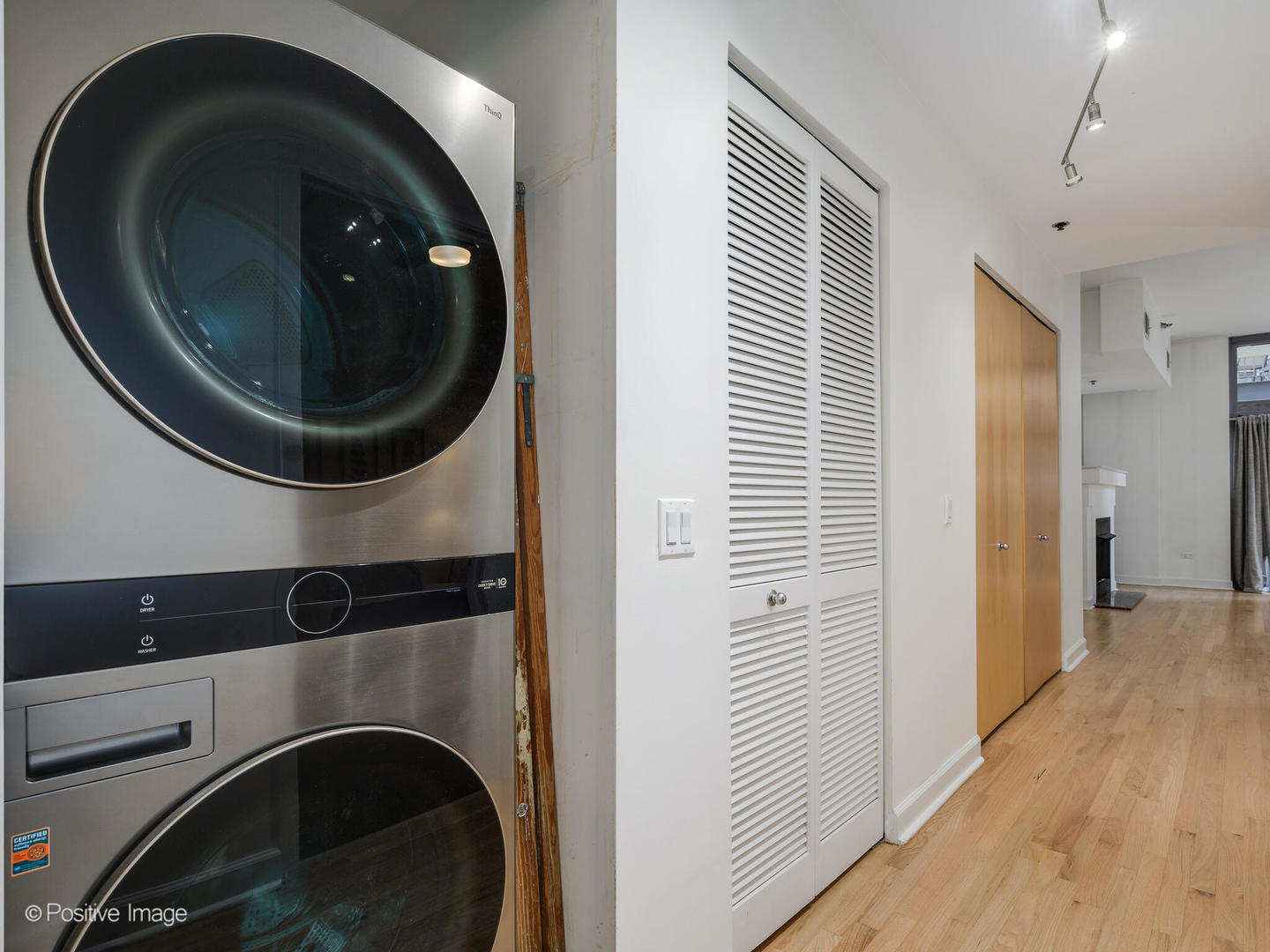1201 West Adams Street, Unit 608 Chicago, IL 60607 - Photo 14 of 14 a view of a hallway with washer and dryer