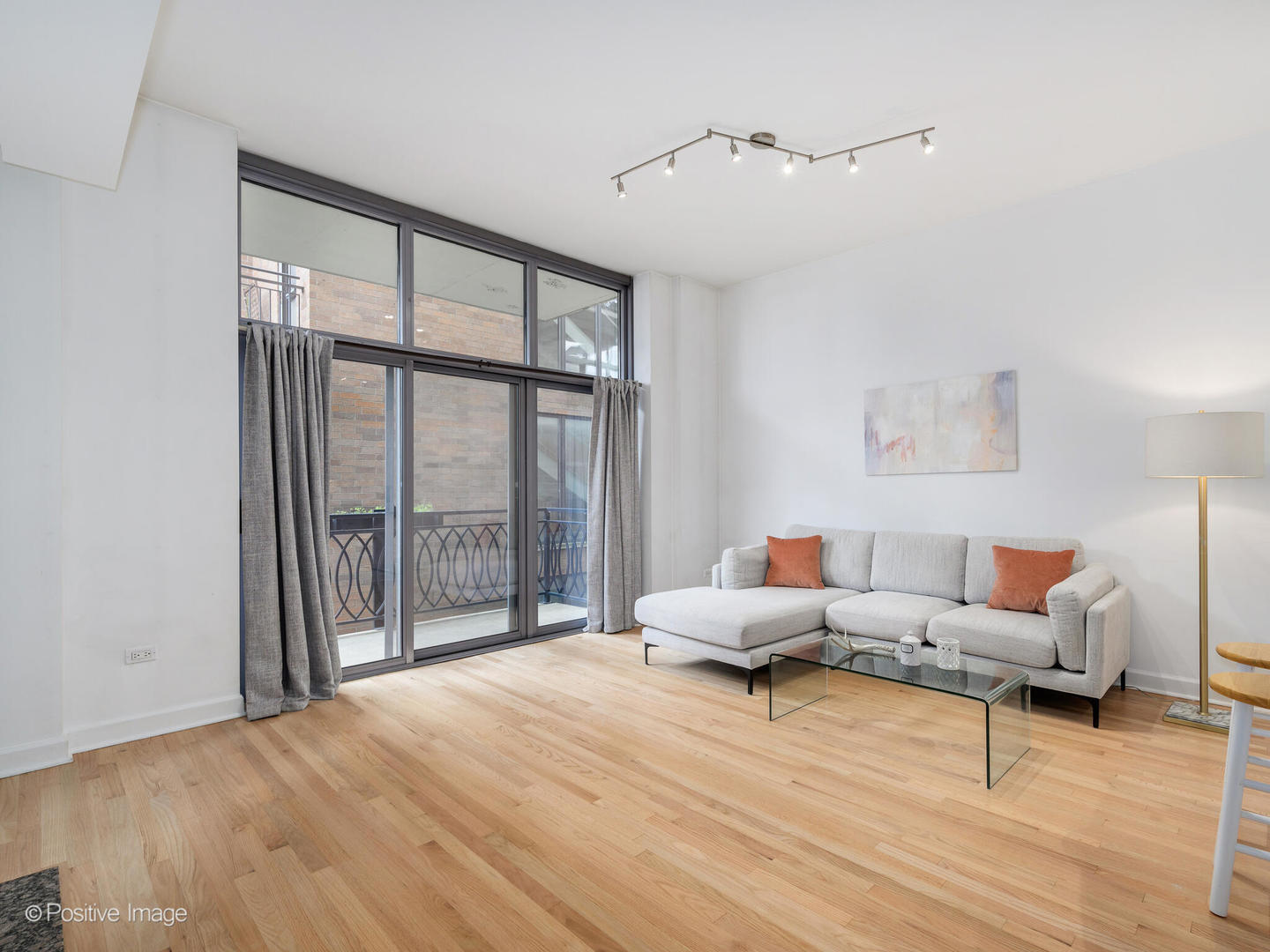 1201 West Adams Street, Unit 608 Chicago, IL 60607 - Photo 6 of 14 a living room with furniture and a large window