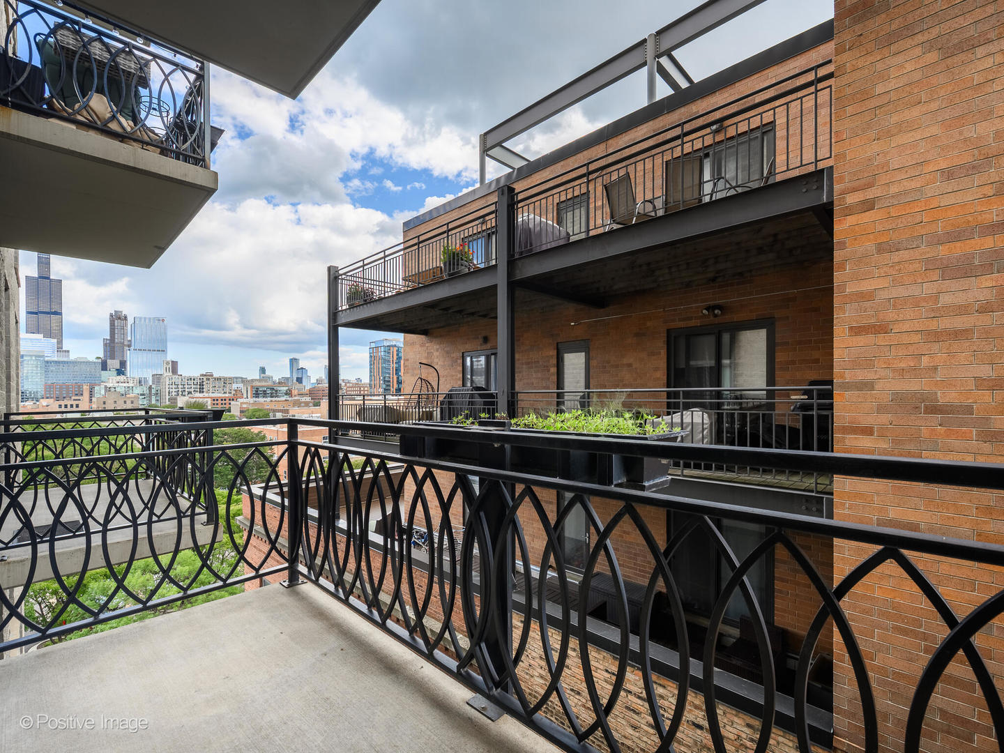 1201 West Adams Street, Unit 608 Chicago, IL 60607 - Photo 9 of 14 a view of a chair and tables in the balcony