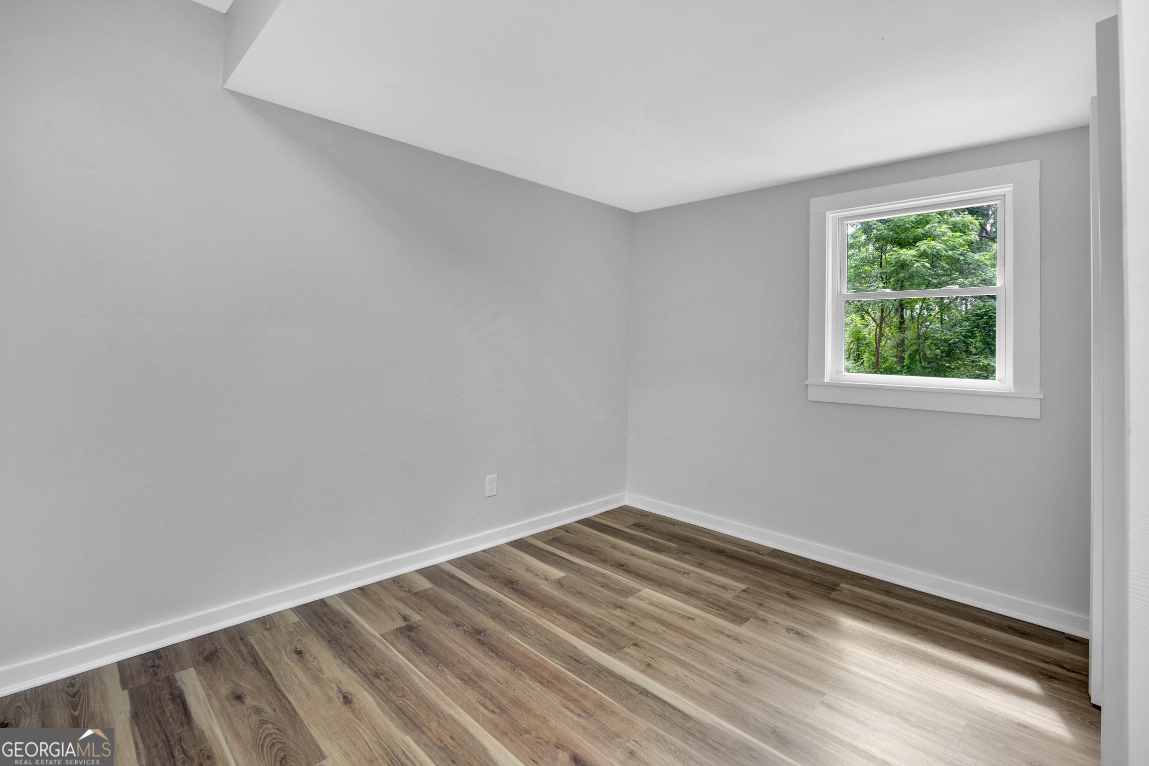 455 Cindy Street Jackson, GA 30233 - Photo 12 of 25 a view of a room with wooden floor and natural light
