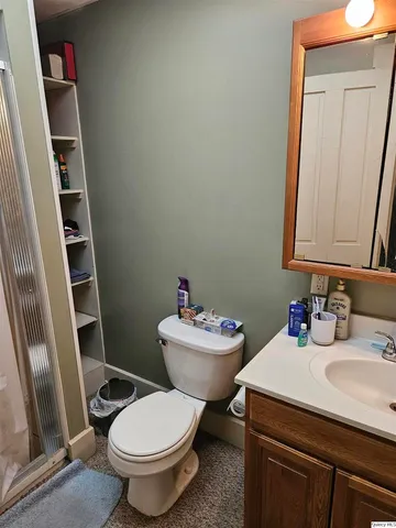 a bedroom with bed and window