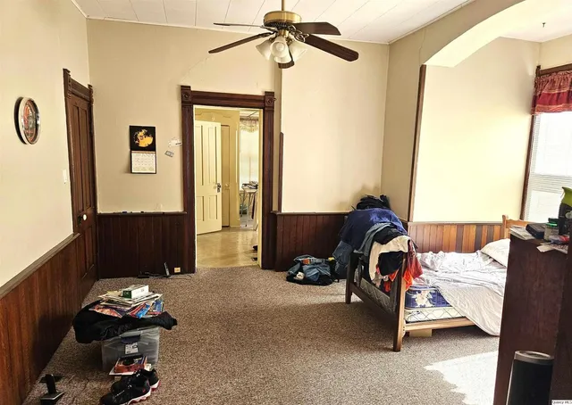 a kitchen with stainless steel appliances granite countertop a stove a refrigerator and a wooden cabinets