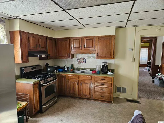 a bathroom with a sink vanity mirror and toilet