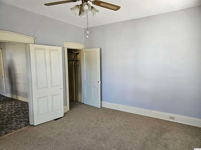 a white refrigerator freezer and a stove sitting inside of a kitchen