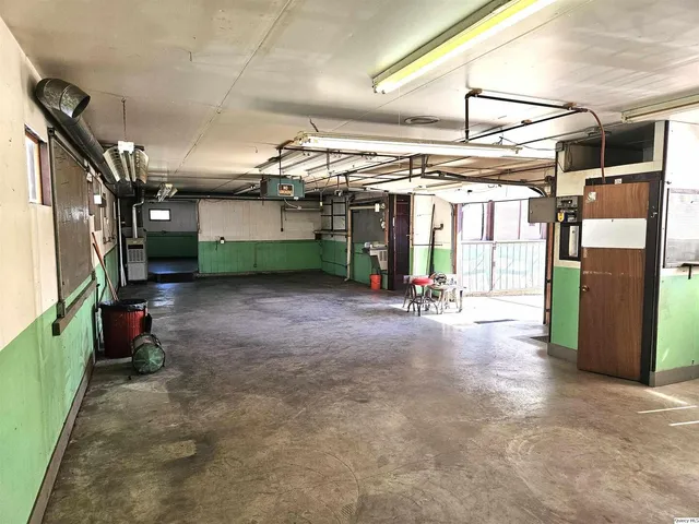 a view of a garage with a sink and a dishwasher