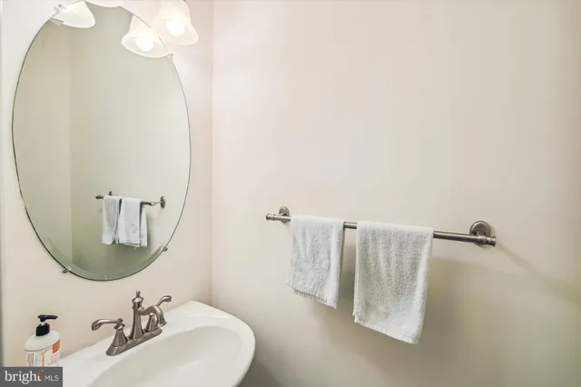 a bathroom with a sink and mirror