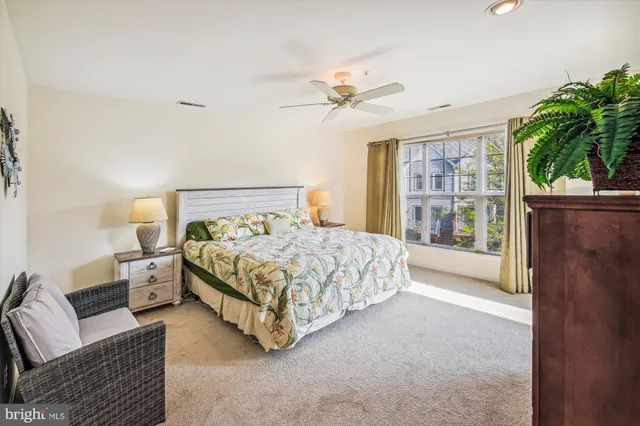 a bedroom with a bed couch and table