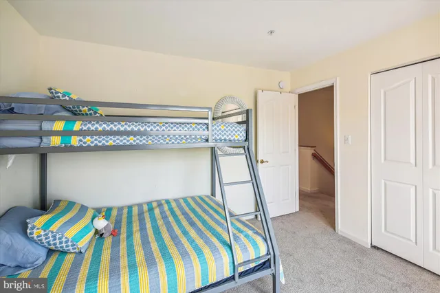 a bedroom with a bed and a table