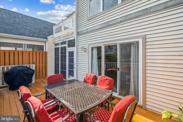 a balcony with furniture and a potted plant