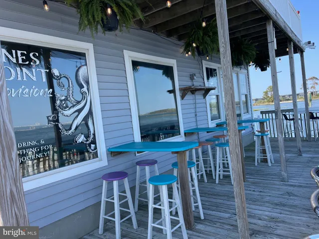 a view of a chairs with table in front of house