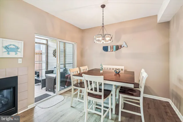 a view of a dining room with furniture wooden floor and chandelier