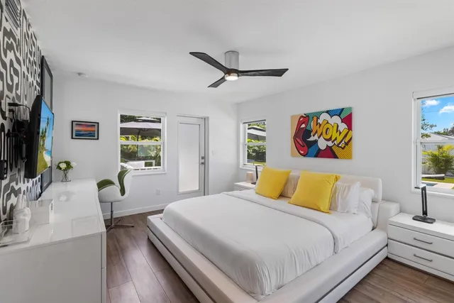 a bedroom with a bed and a table