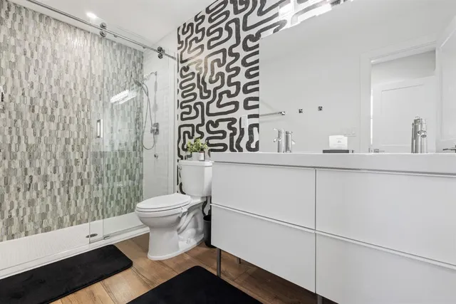a bathroom with a toilet and a shower curtain