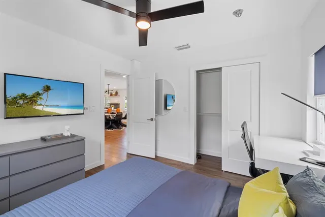 a view of living room with furniture and ceiling fan