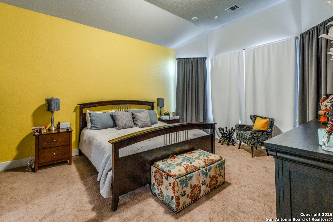 1712 Delafield Road San Antonio, TX 78253 - Photo 13 of 25 a bedroom with a bed and a couch