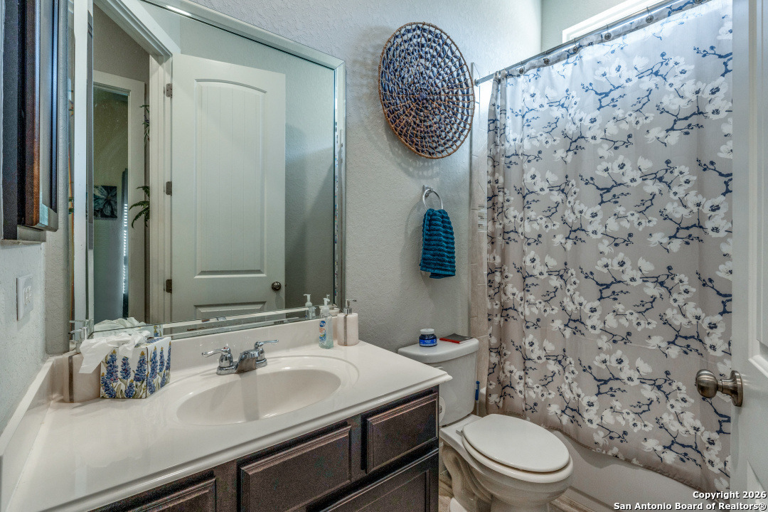 1712 Delafield Road San Antonio, TX 78253 - Photo 16 of 25 a bathroom with a toilet sink and mirror