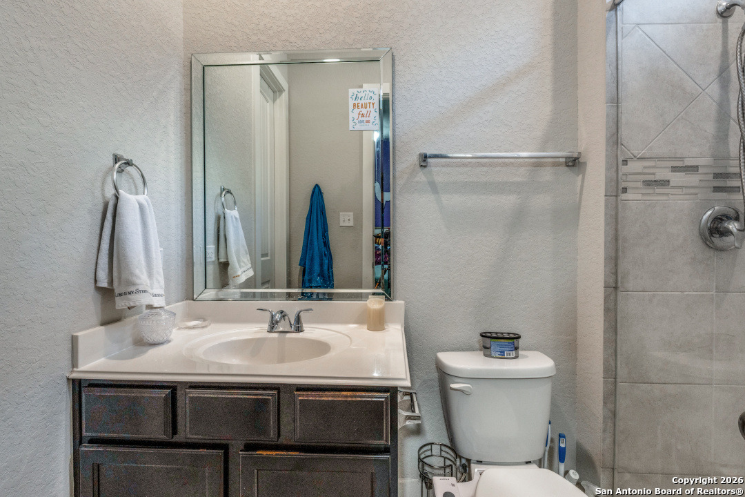 1712 Delafield Road San Antonio, TX 78253 - Photo 19 of 25 a bathroom with a sink toilet and shower
