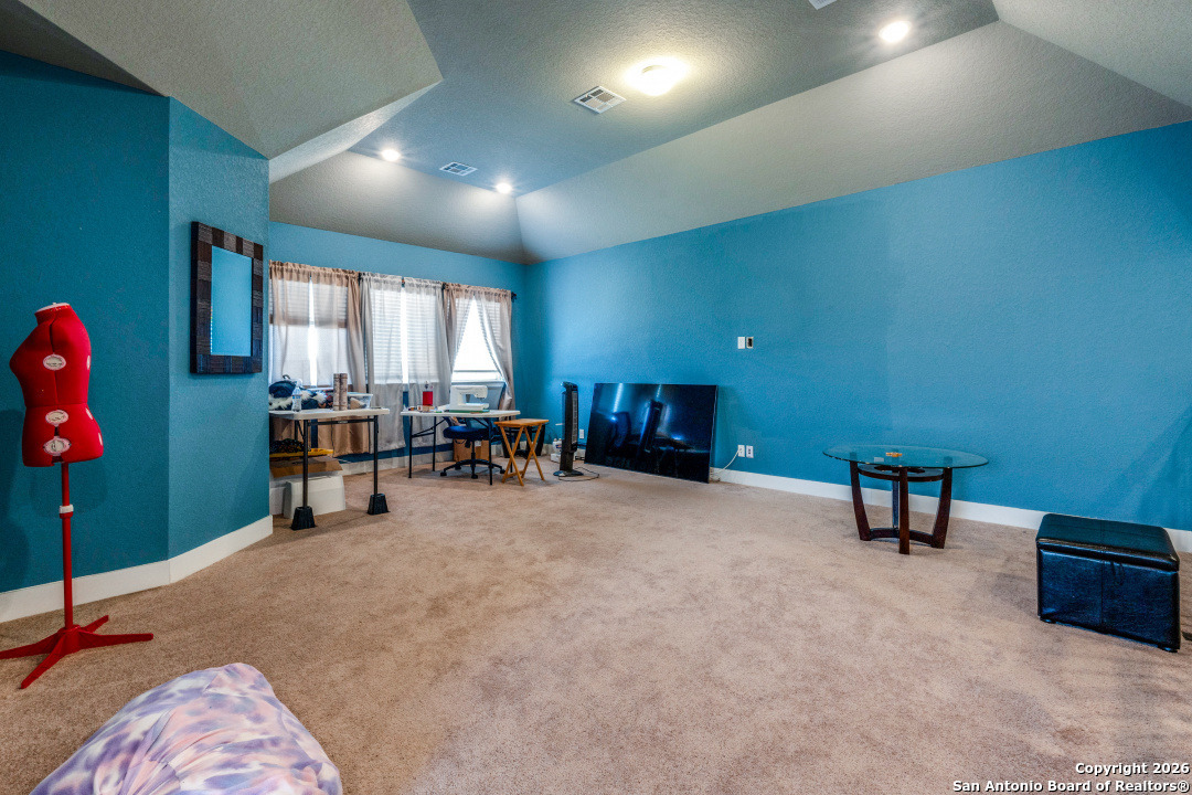 1712 Delafield Road San Antonio, TX 78253 - Photo 22 of 25 a room with furniture and a flat screen tv