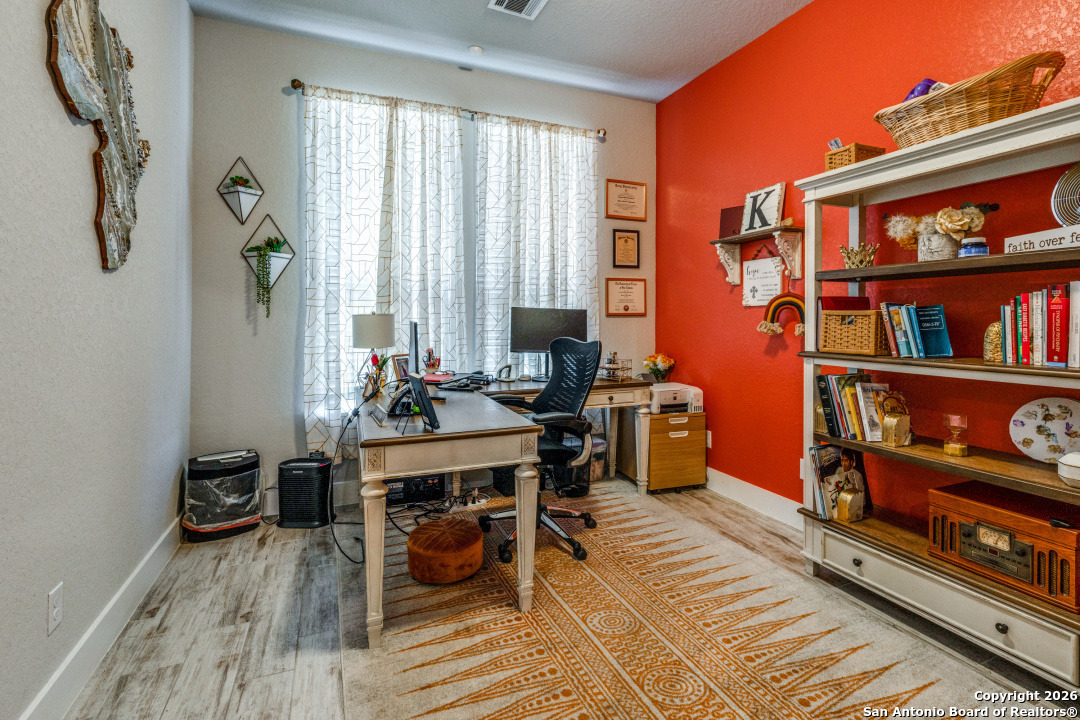 1712 Delafield Road San Antonio, TX 78253 - Photo 6 of 25 a view of a workspace with furniture and a window